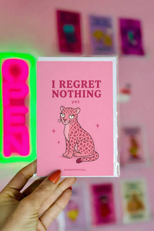 Funny sarcastic greeting card with a pink leopard and text “I regret nothing yet” on a pink background
