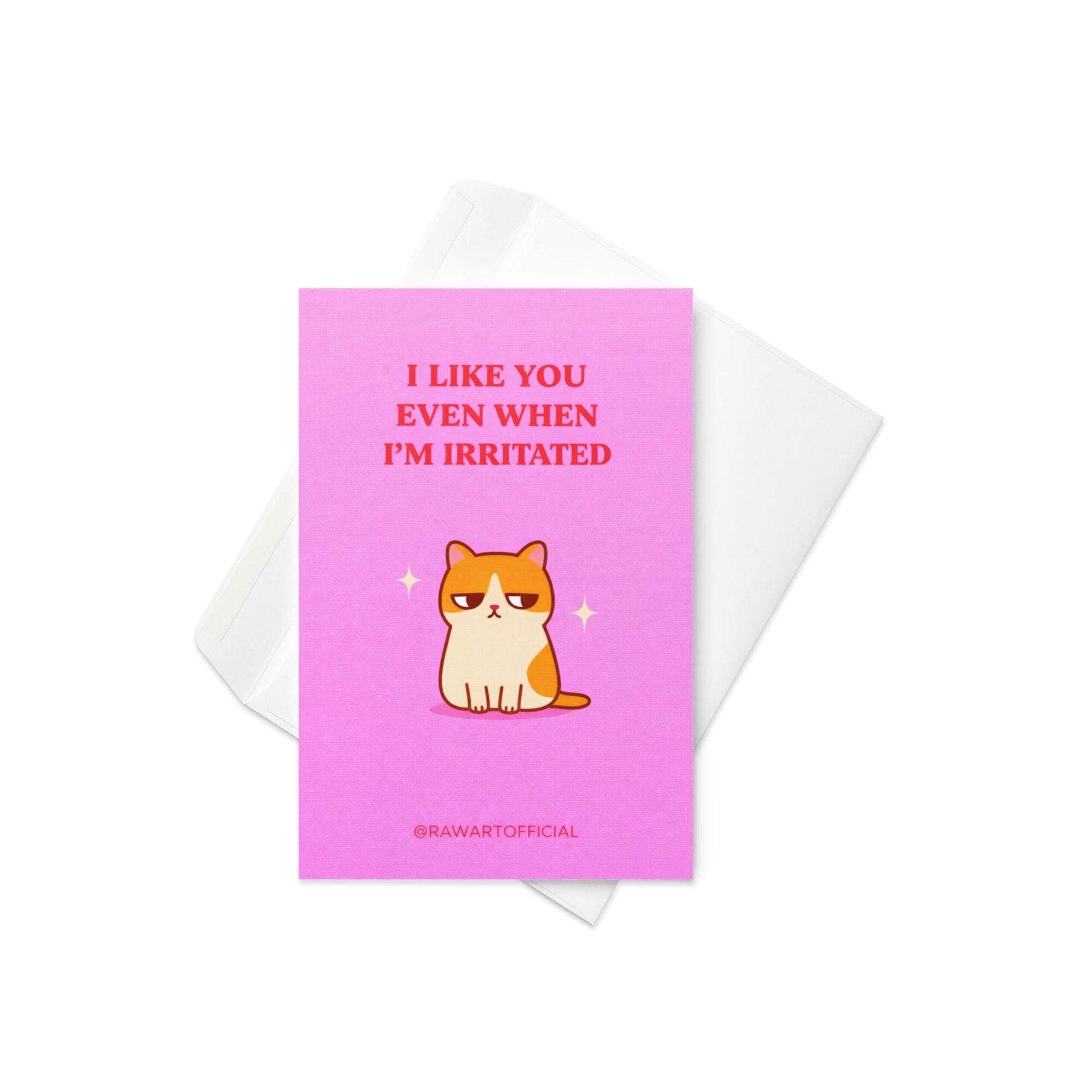 Funny love card featuring an unimpressed orange and white cat with text “I like you even when I’m irritated” on a pink background