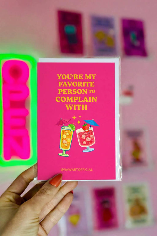Funny friendship card with two cocktails and text “You’re my favorite person to complain with” on a bright pink background
