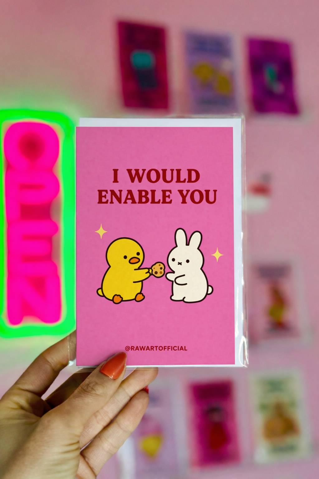 Funny cute relationship card featuring a duck giving a cookie to a bunny with text “I would enable you” on a pink background