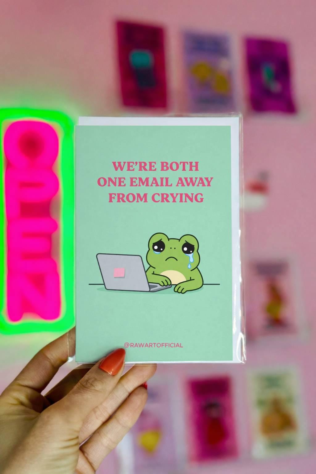 Funny coworker birthday card with text “we’re both one email away from crying” on a soft green background