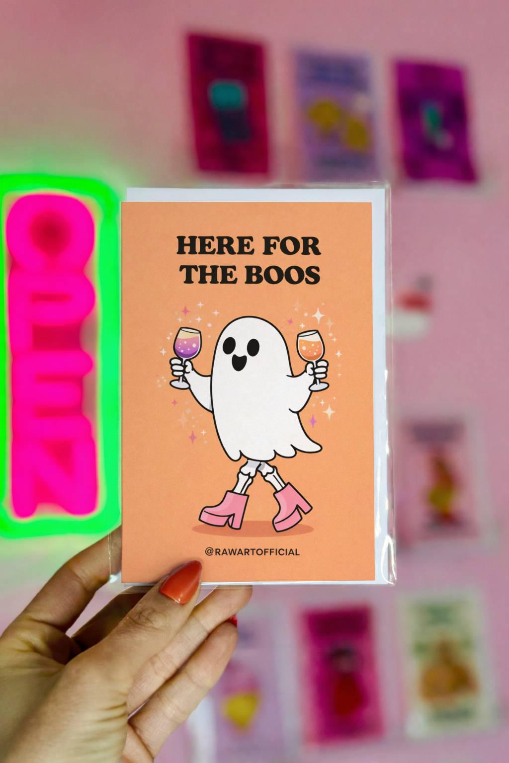 Spooky ghost greeting card with “here for the boos” drinking joke on festive Halloween style background