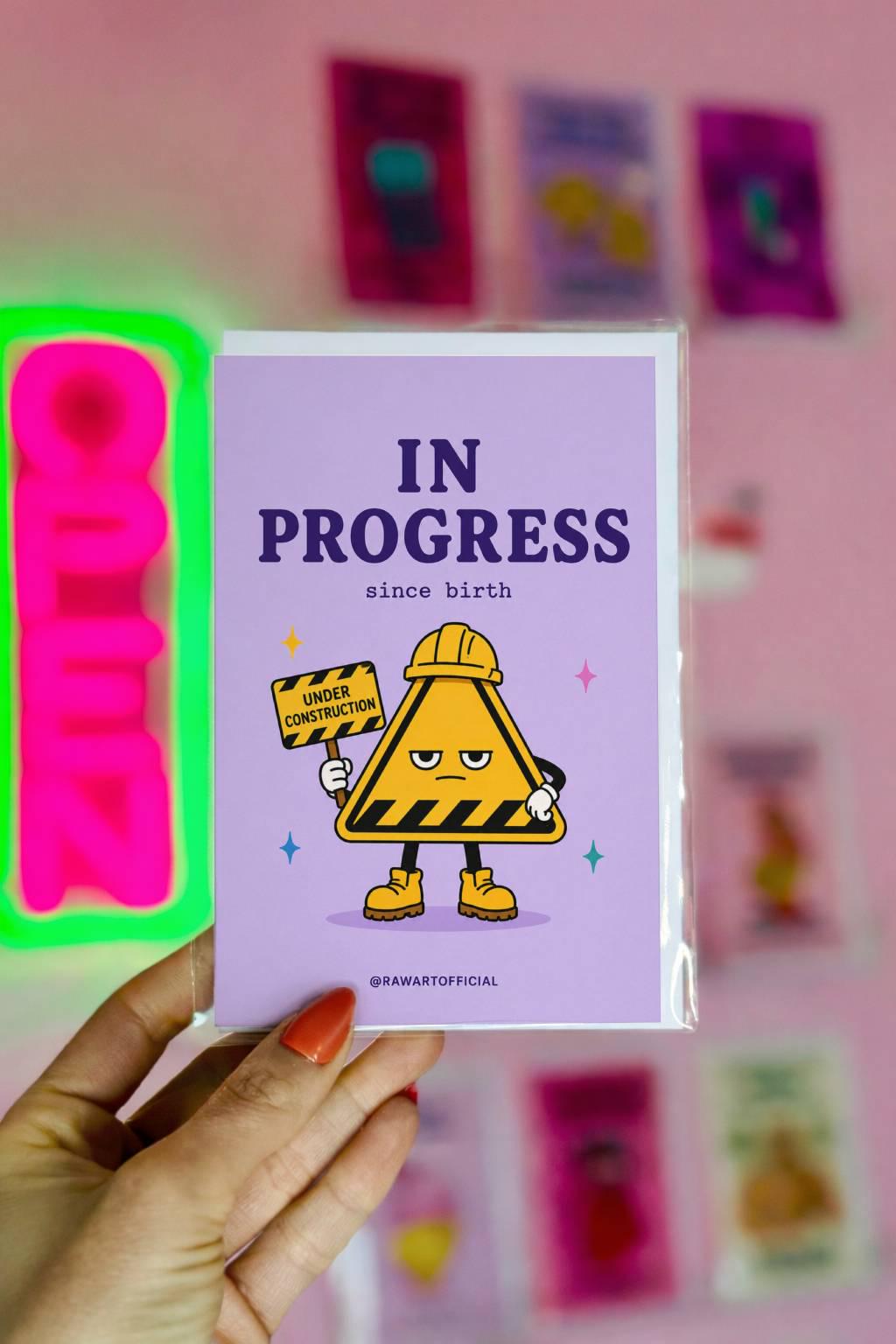Funny birthday card with construction sign character saying in progress since birth