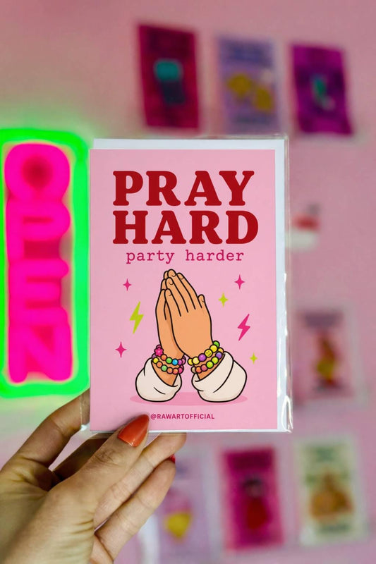 Funny rave birthday greeting card with praying hands wearing kandi bracelets, text reads “pray hard party harder”