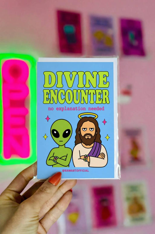 Funny birthday card with alien and Jesus standing together, text says “divine encounter no explanation needed”