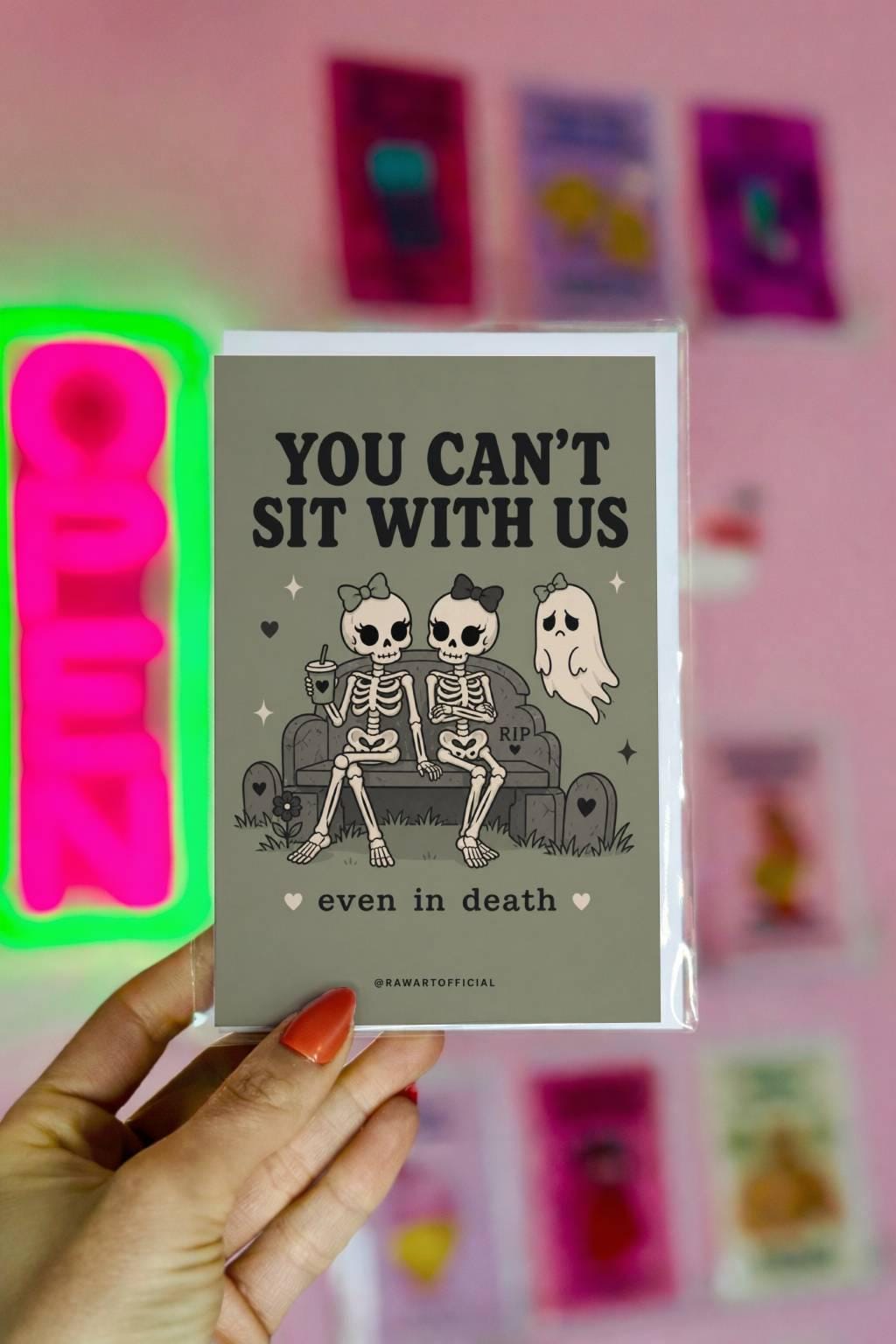 Funny spooky card with skeleton friends rejecting a ghost saying you cannot sit with us