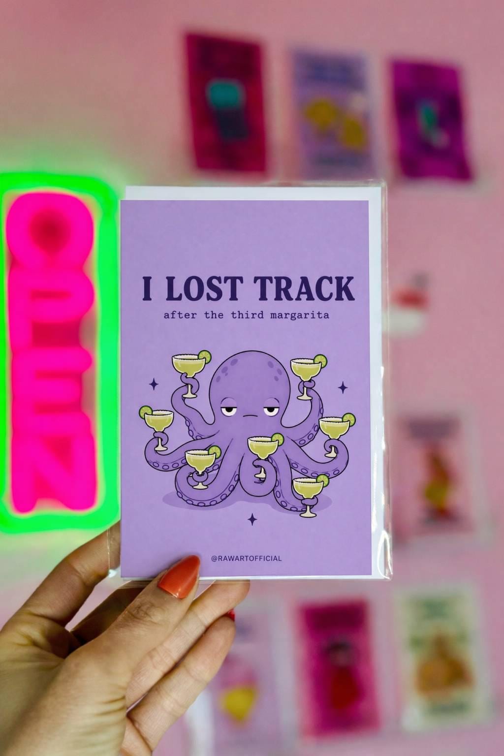 Funny drinking greeting card with an octopus holding margaritas and text “I lost track after the third margarita” on a purple background