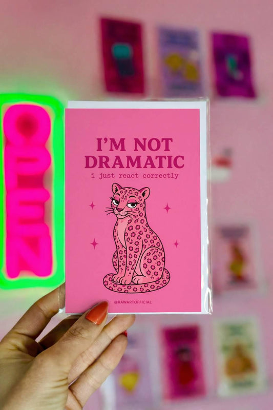 Funny sarcastic greeting card with a pink leopard and text “I’m not dramatic I just react correctly” on a pink background