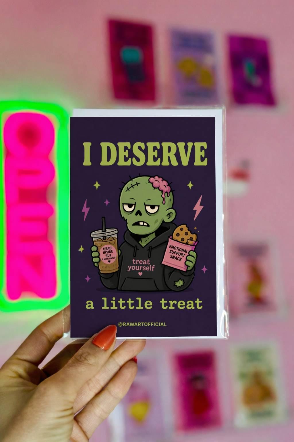 Funny zombie birthday card holding iced coffee and snack, text says “I deserve a little treat”