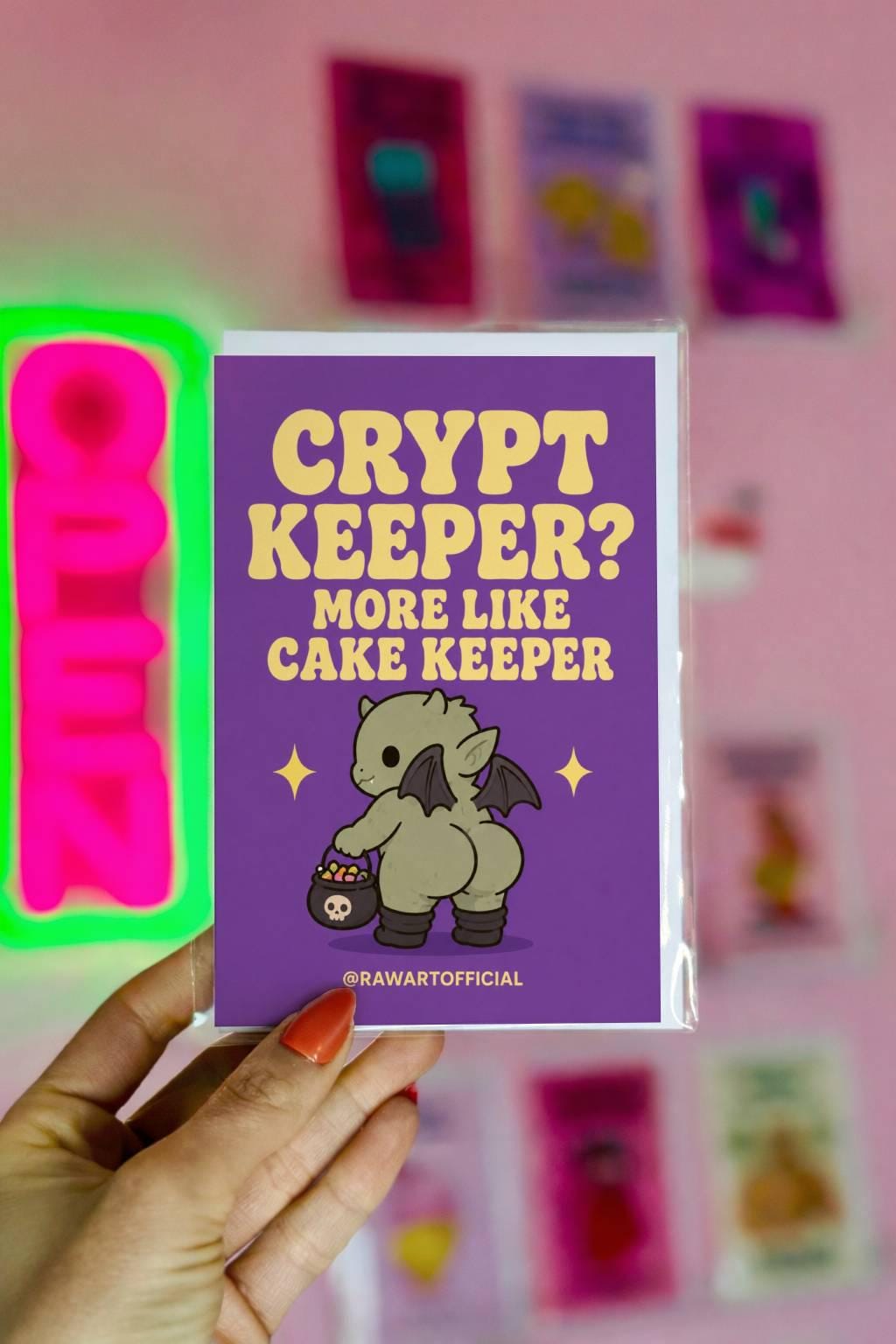 Funny Halloween greeting card with cute candy corn witch booty character holding candy bucket and retro text reading “Sweet Cheeks” on orange background.