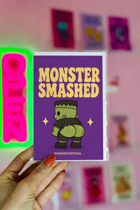 Funny Halloween greeting card with a cute Frankenstein monster from behind and the text “Monster Smashed” on a purple background.
