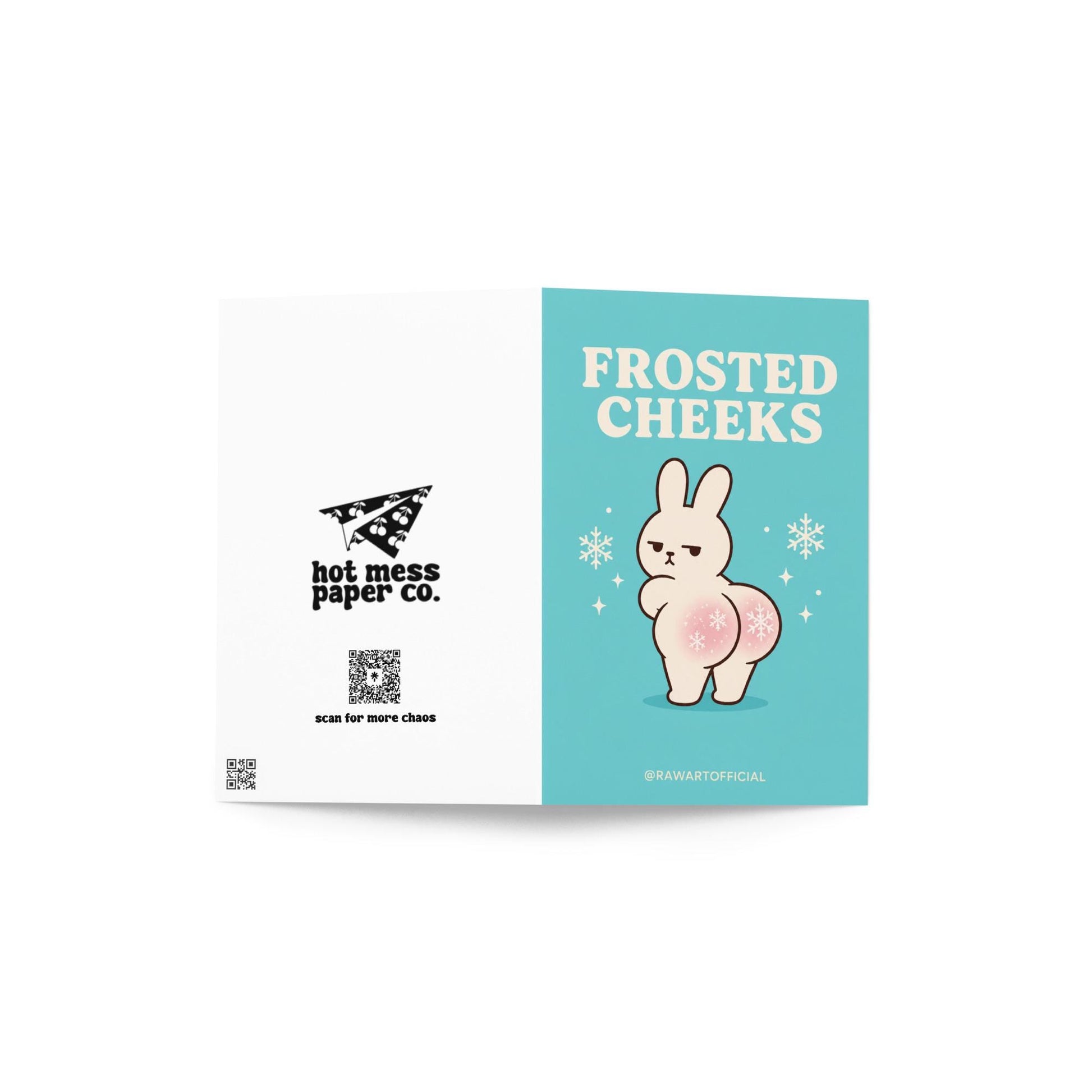 Funny Christmas card featuring a grumpy bunny with snowflake cheeks beside the phrase “Frosted Cheeks.”