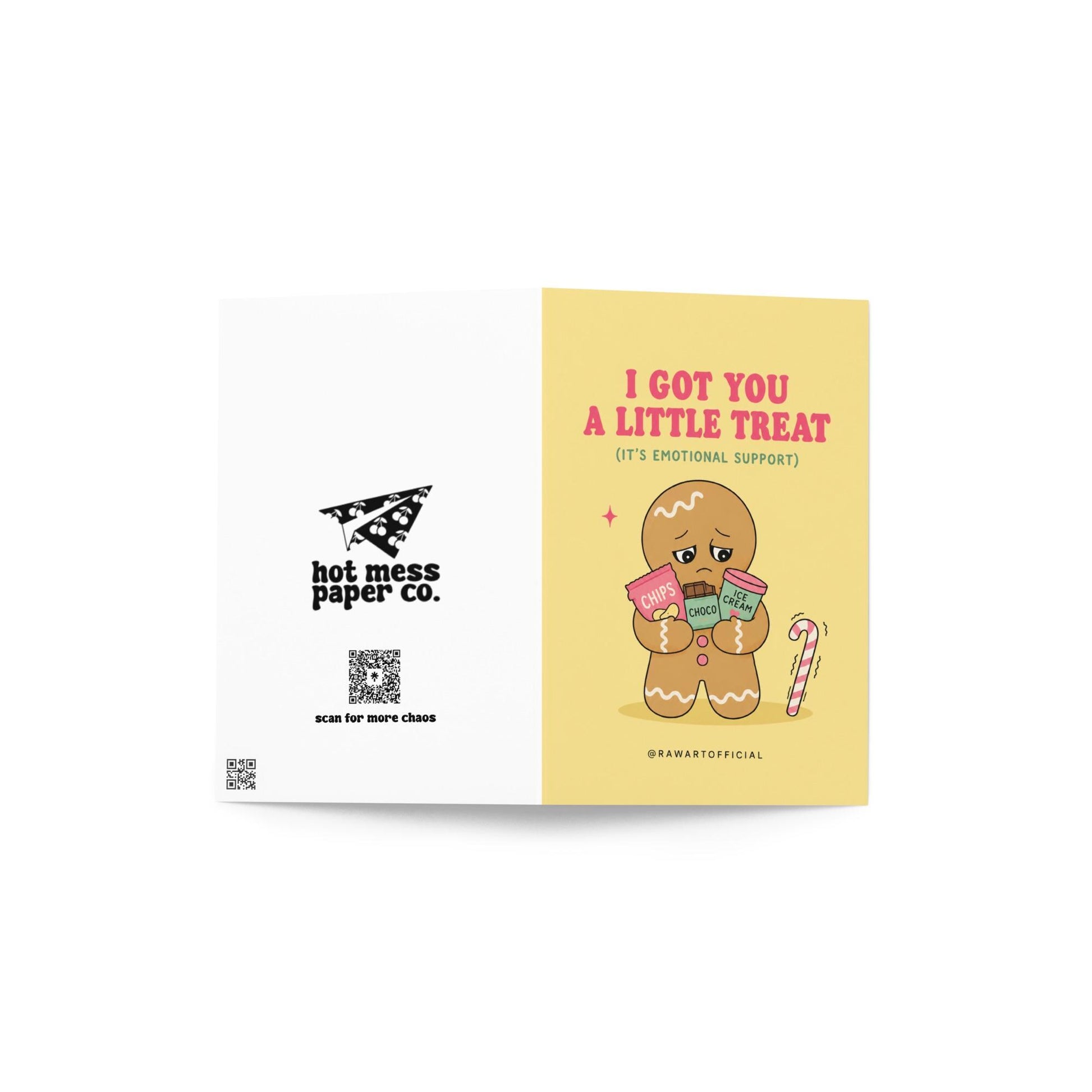 Funny Christmas card featuring a gingerbread cookie holding chips, chocolate, and ice cream beside the phrase “I Got You A Little Treat (It’s Emotional Support).”