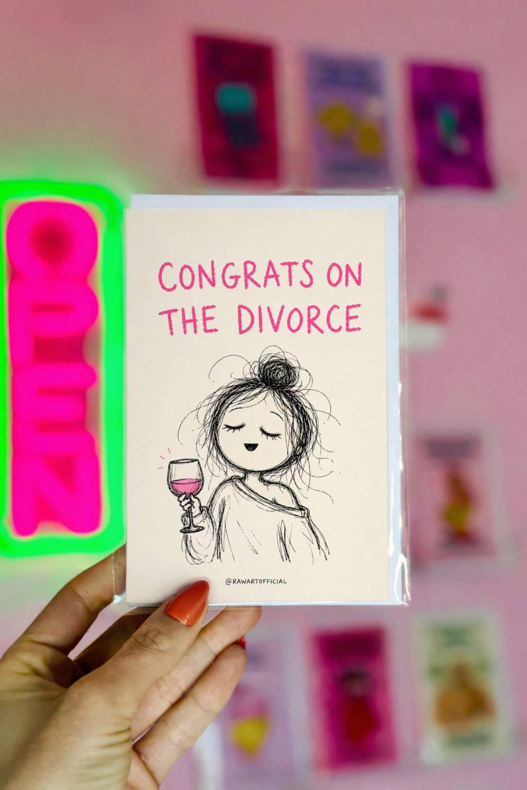 Funny divorce greeting card featuring a scribbly woman holding wine beside the phrase “Congrats on the Divorce” with humorous inside artwork including a flaming wedding cake.