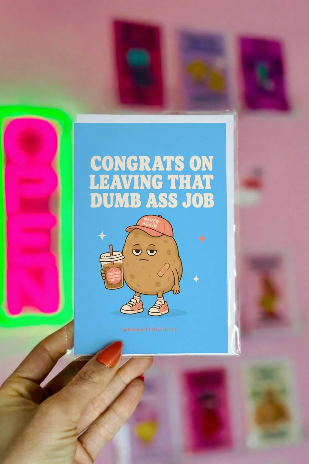 Funny quitting job card with a tired potato holding iced coffee beside the phrase “Congrats On Leaving That Dumb Ass Job.”