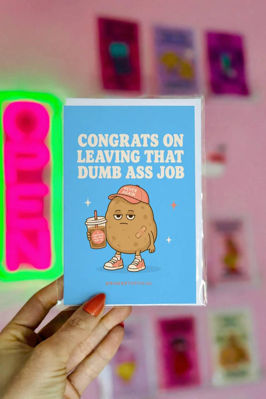 Funny quitting job card with a tired potato holding iced coffee beside the phrase “Congrats On Leaving That Dumb Ass Job.”