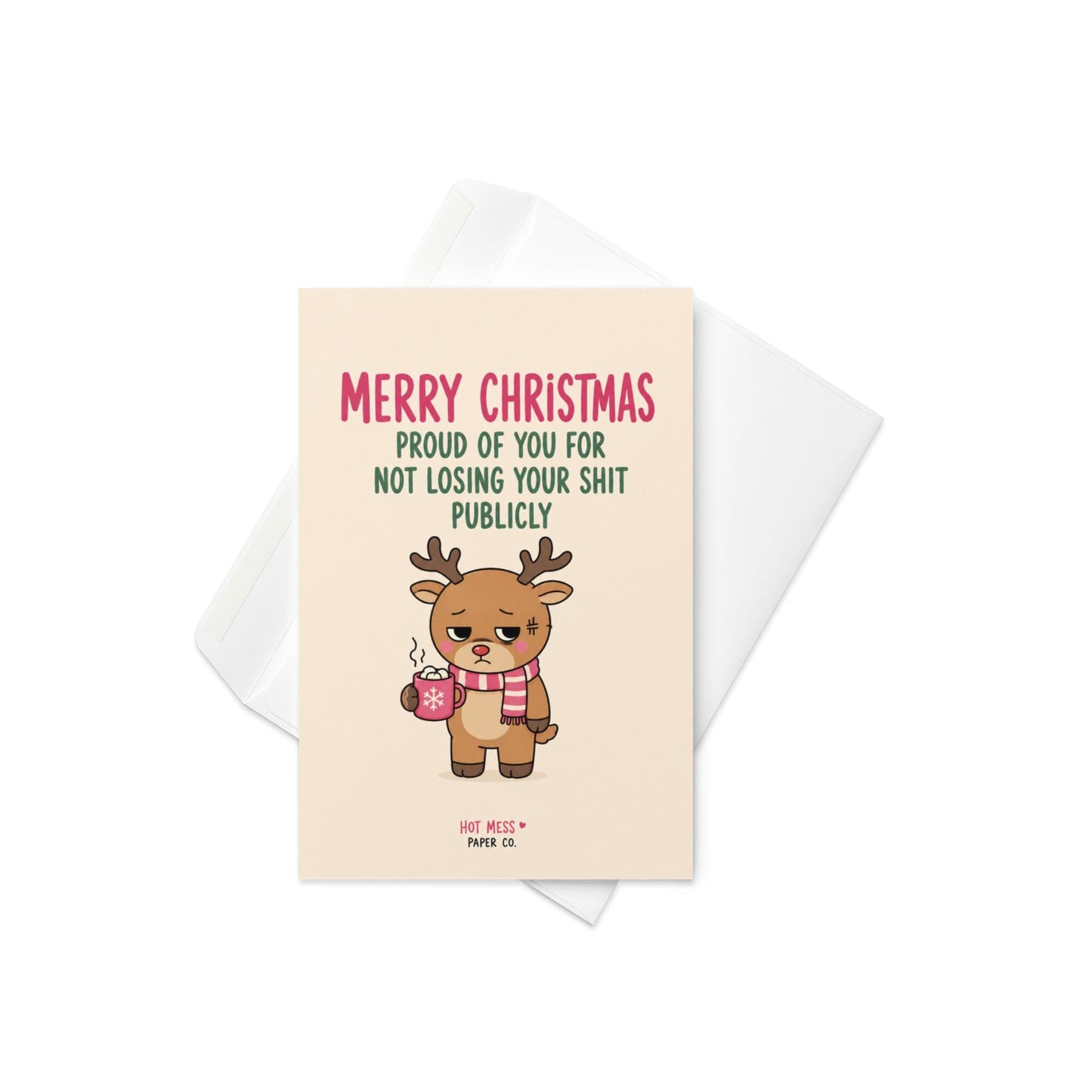 Funny Christmas card featuring a tired reindeer holding hot cocoa beside the phrase “Proud Of You For Not Losing Your Shit Publicly.”