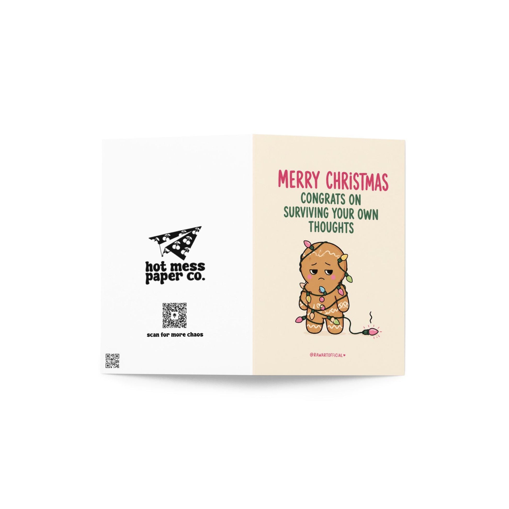 Funny Christmas card featuring a stressed gingerbread cookie tangled in Christmas lights beside the phrase “Congrats On Surviving Your Own Thoughts.”
