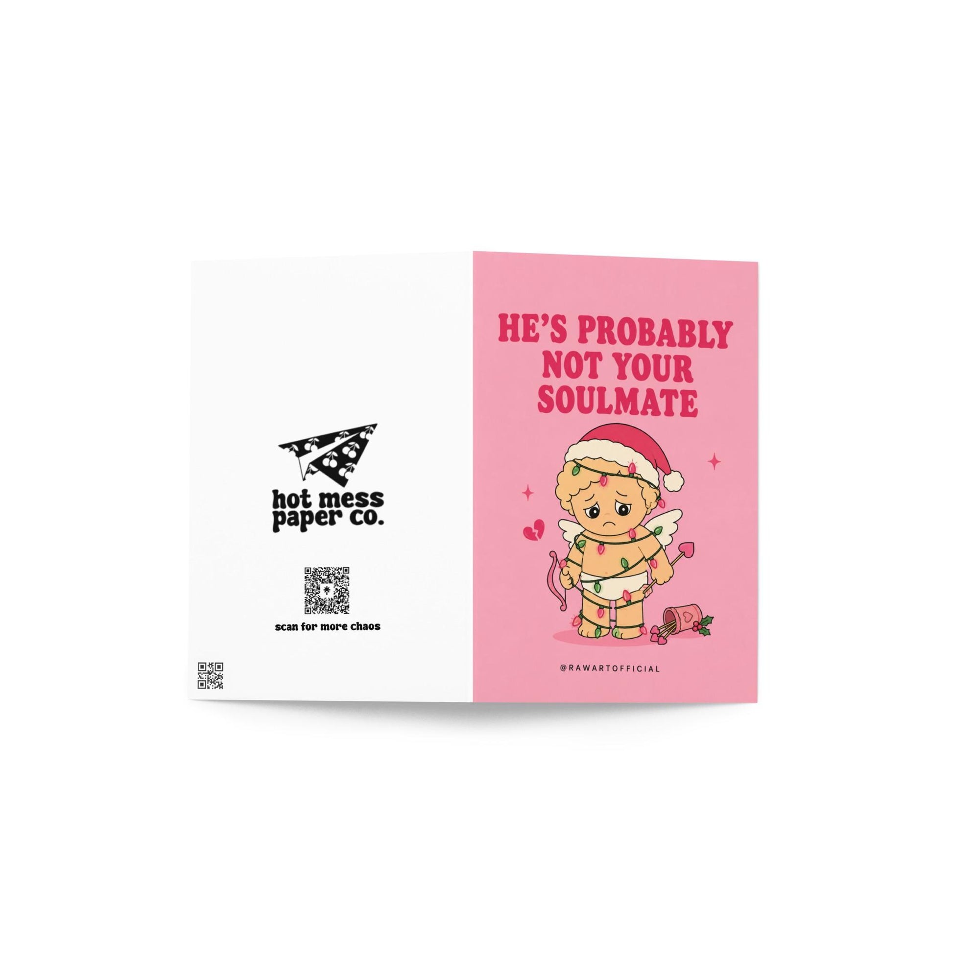 Funny Christmas card featuring a sad cupid tangled in Christmas lights beside the phrase “He’s Probably Not Your Soulmate.”