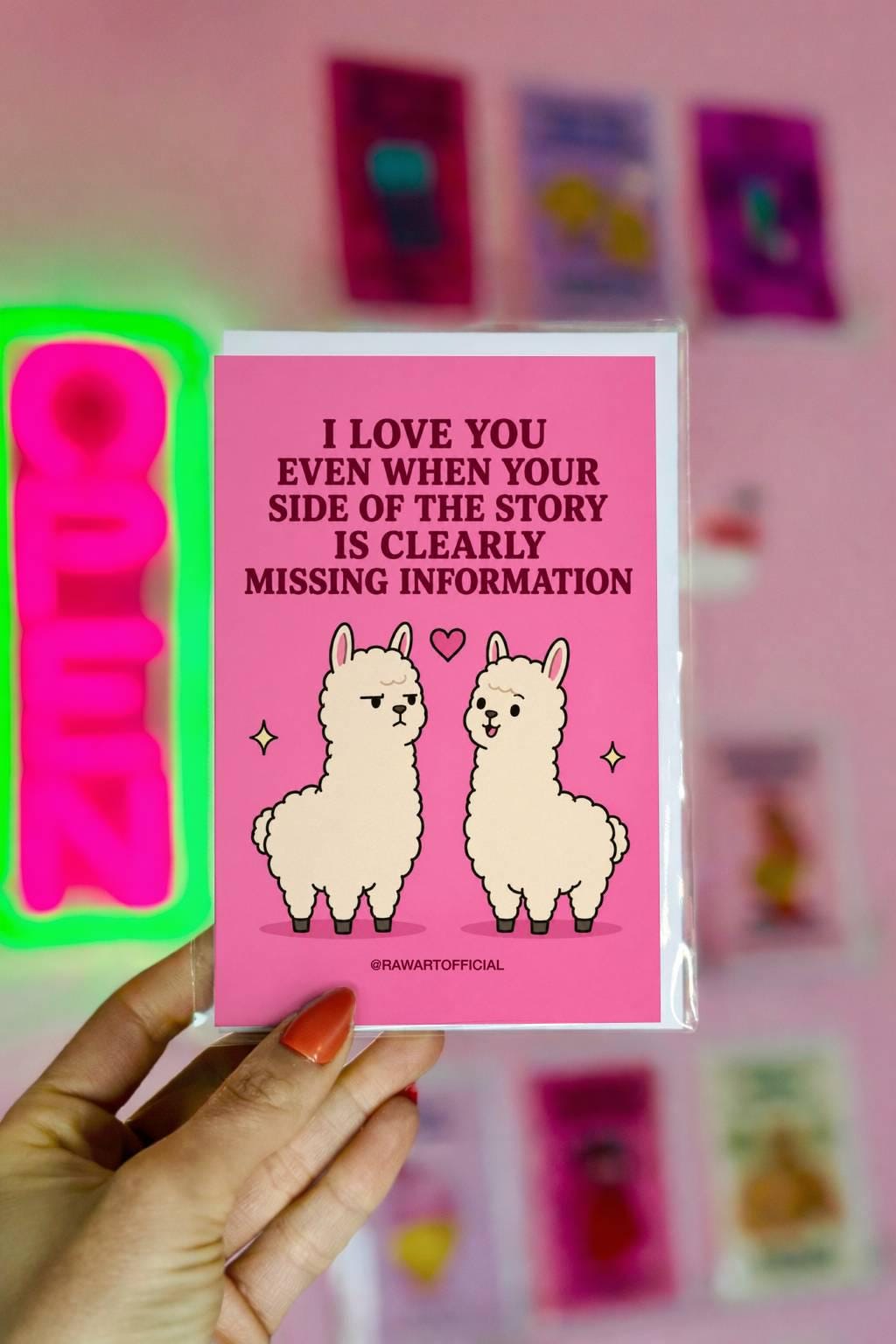 Funny relationship card featuring two llamas beside the phrase “I Love You Even When Your Side of the Story Is Clearly Missing Information.”