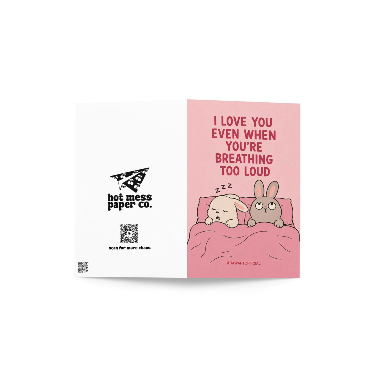 Funny relationship card featuring two bunnies sharing a bed, one sleeping while the other looks annoyed, beneath the phrase “I Love You Even When You’re Breathing Too Loud.”