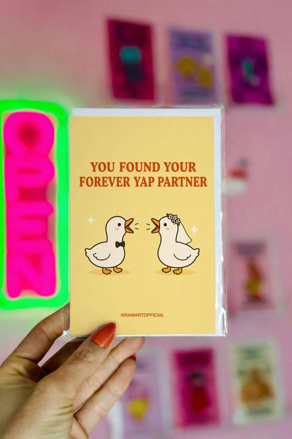 Funny wedding card featuring two cute geese dressed as a bride and groom with the phrase “You Found Your Forever Yap Partner.”