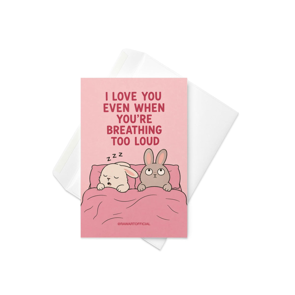 Funny relationship card featuring two bunnies sharing a bed, one sleeping while the other looks annoyed, beneath the phrase “I Love You Even When You’re Breathing Too Loud.”