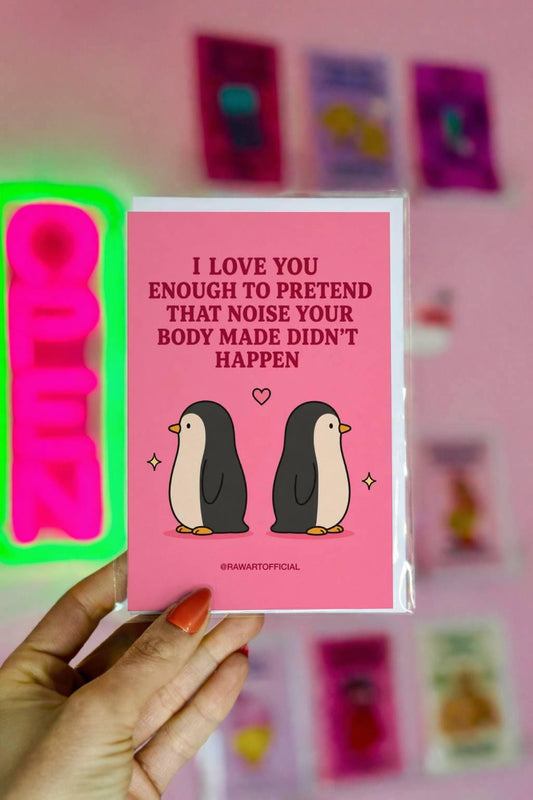 Funny couples card featuring two penguins facing away from each other beneath the phrase “I Love You Enough to Pretend That Noise Your Body Made Didn’t Happen.”