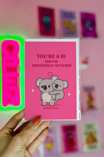 Funny Valentine card featuring one koala clinging to another beneath the phrase “You’re a 10 and I’m Emotionally Attached.”