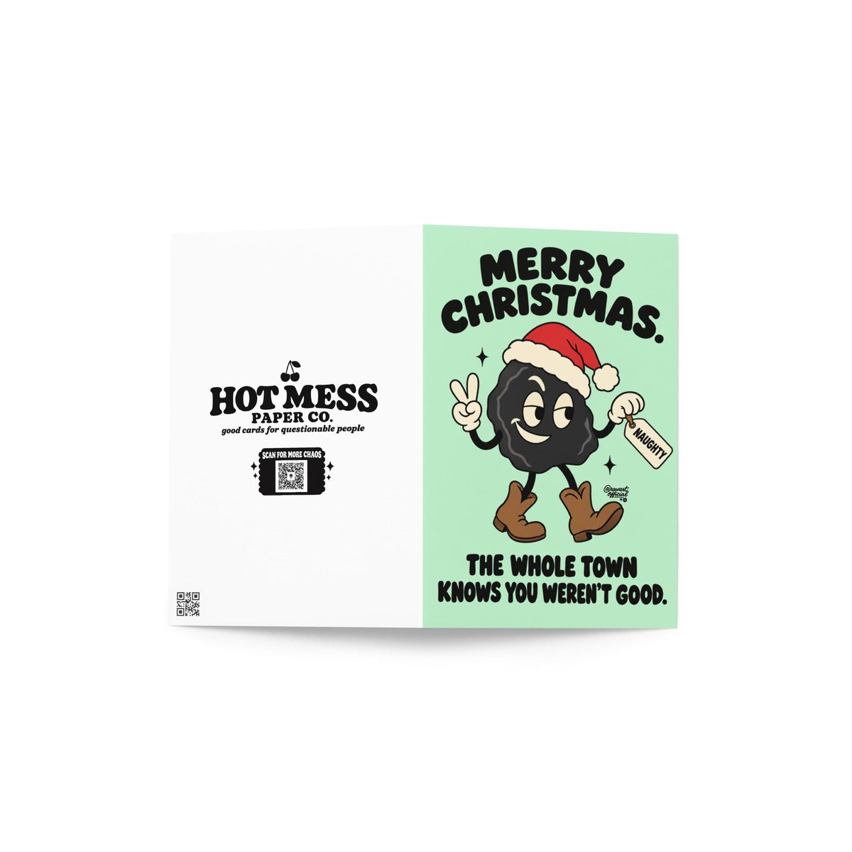 Funny Christmas greeting card featuring a smiling black lump of coal wearing a red Santa hat and brown cowboy boots, flashing a peace sign and holding a naughty list tag. Mint-green background with bold black retro lettering reading “Merry Christmas. The Whole Town Knows You Weren't Good.” Humorous small-town holiday card inspired by Christmas gossip and Santa's naughty list.