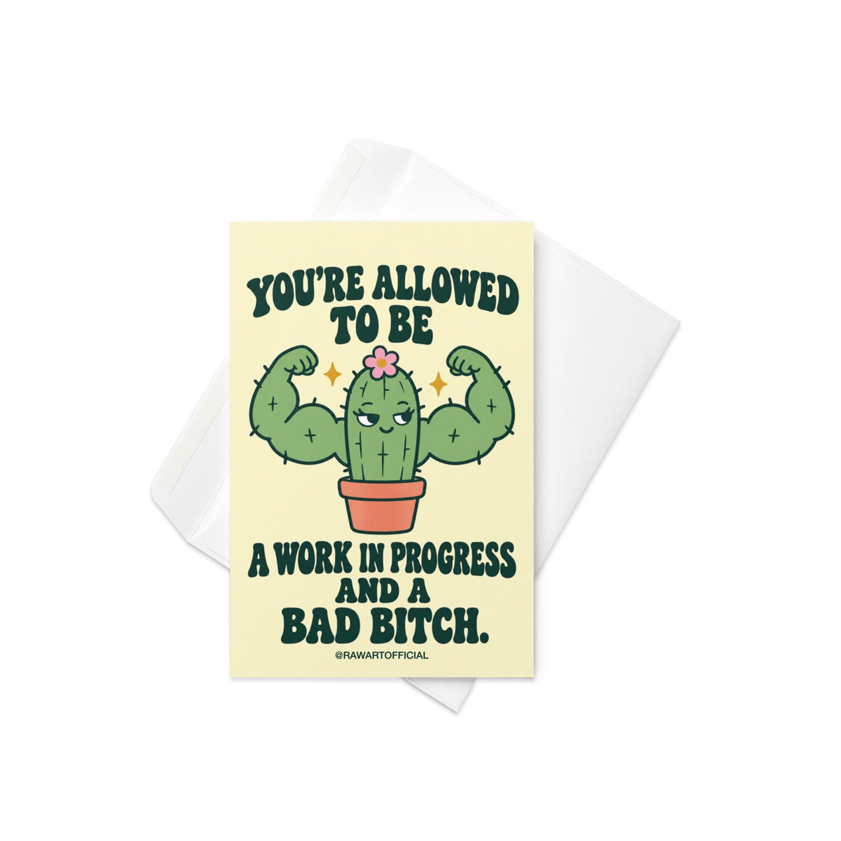 Funny encouragement greeting card featuring a green cartoon cactus flexing oversized muscular arms, with a smug expression, tiny pink flower, and terracotta pot. Pale yellow background with bold dark green retro lettering reading “You're Allowed to Be a Work in Progress and a Bad Bitch.” Humorous self-love and confidence card by Hot Mess Paper Co.