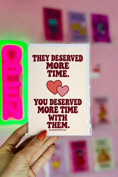 Heartfelt sympathy greeting card featuring two overlapping coral and pink hearts on a warm cream background. Bold burgundy retro lettering reads “They Deserved More Time. You Deserved More Time With Them.” Meaningful bereavement and condolence card for someone grieving the loss of a loved one, by Hot Mess Paper Co.