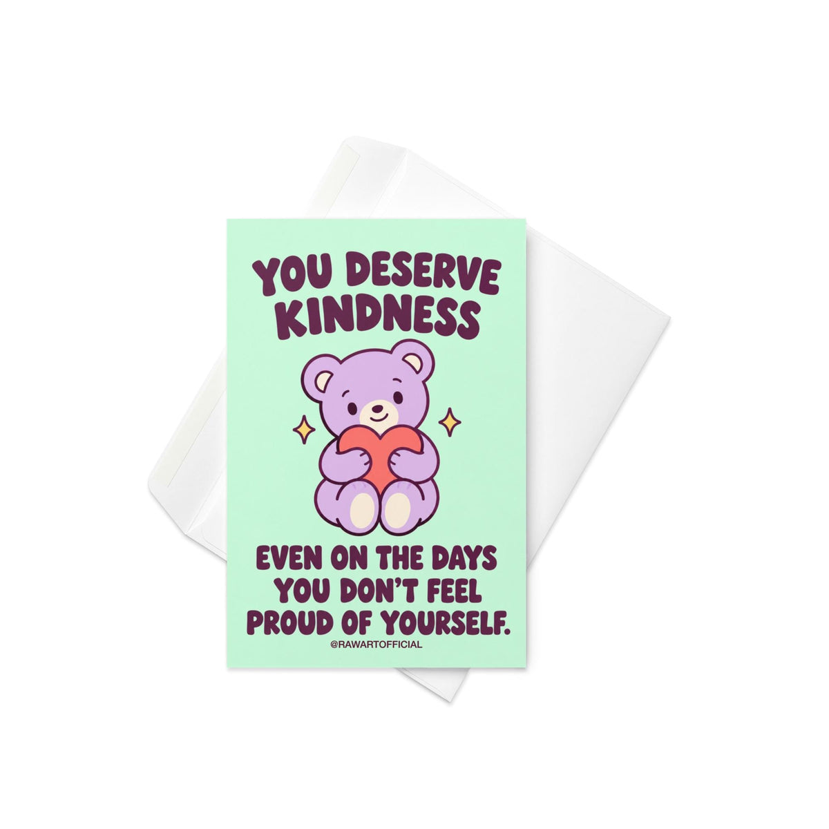 Heartfelt encouragement greeting card featuring a cute lavender teddy bear holding a coral pink heart, surrounded by small golden sparkles on a mint-green background. Bold dark plum retro lettering reads “You Deserve Kindness Even on the Days You Don't Feel Proud of Yourself.” Gentle self-love and self-compassion card by Hot Mess Paper Co.