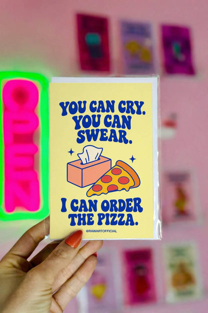 Unconventional sympathy greeting card featuring a peach-coloured tissue box and a slice of pepperoni pizza on a soft yellow background. Bold blue retro lettering reads “You Can Cry. You Can Swear. I Can Order the Pizza.” A heartfelt, lighthearted grief support card offering comfort and friendship during difficult times.