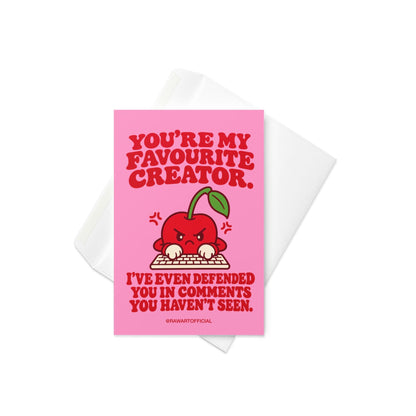 Funny content creator appreciation greeting card featuring an angry red cartoon cherry typing at a computer keyboard on a bright pink background. Bold red retro lettering reads “You're My Favourite Creator. I've Even Defended You in Comments You Haven't Seen.” A humorous influencer thank you card for TikTokers, YouTubers, Instagram creators, and social media personalities.