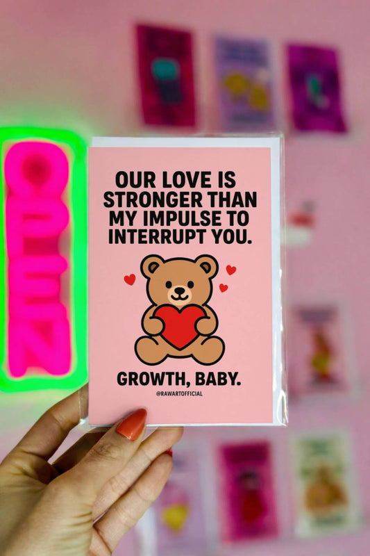 Funny greeting card reading “Our Love Is Stronger Than My Impulse to Interrupt You” with a teddy bear holding a heart on a pink background.