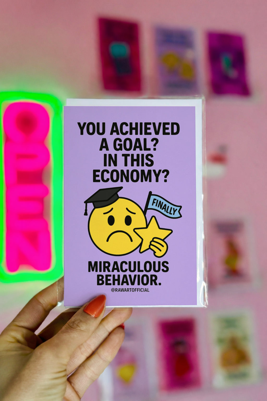 Funny graduation card with sad emoji in grad cap holding star and “In This Economy?” joke.