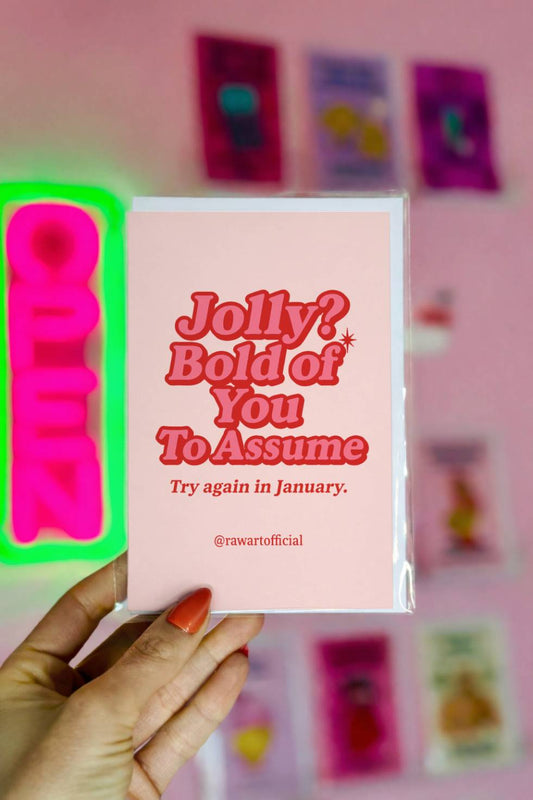 Funny Christmas card with retro red lettering that reads “Jolly? Bold of You To Assume. Try Again in January.”