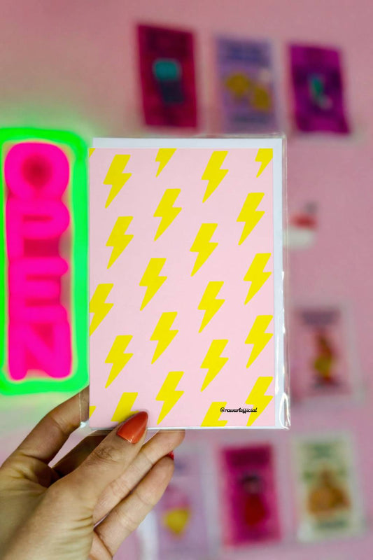 Greeting card featuring a repeating pattern of yellow lightning bolts on a pink background.