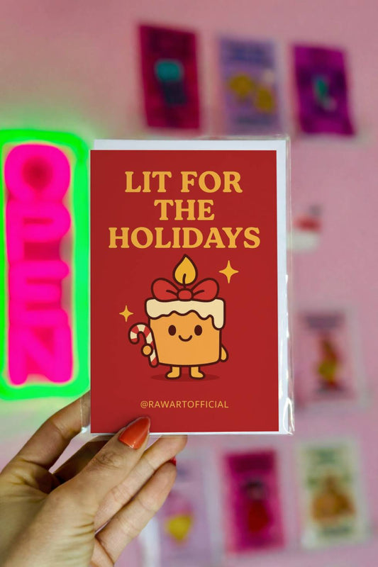 Funny Christmas greeting card featuring a smiling candle character holding a candy cane with the text “Lit for the Holidays.”