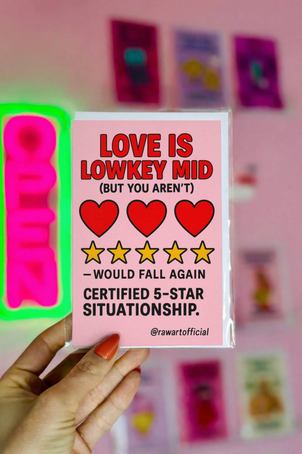 Pink greeting card reading Love Is Lowkey Mid Certified 5 Star Situationship with heart and star icons, @rawartofficial signature.