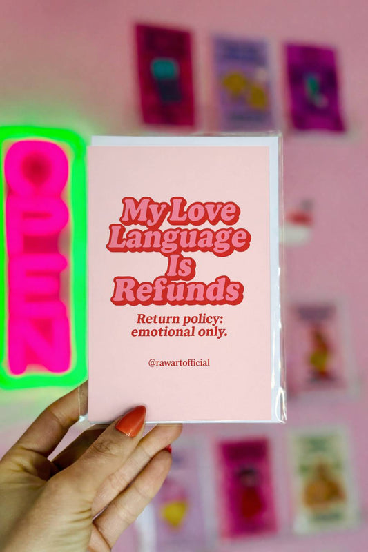 Pink greeting card with bold red retro text reading My Love Language Is Refunds Return Policy Emotional Only and @rawartofficial signature.
