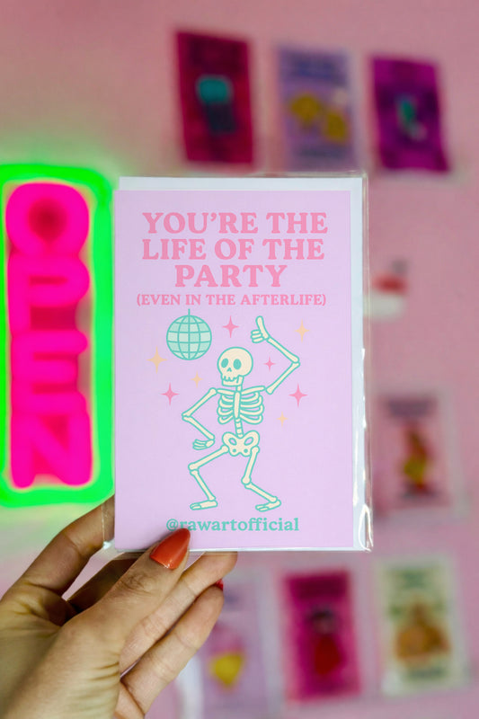 Funny pastel Halloween card with dancing skeleton under disco ball that says “You’re the Life of the Party (Even in the Afterlife).