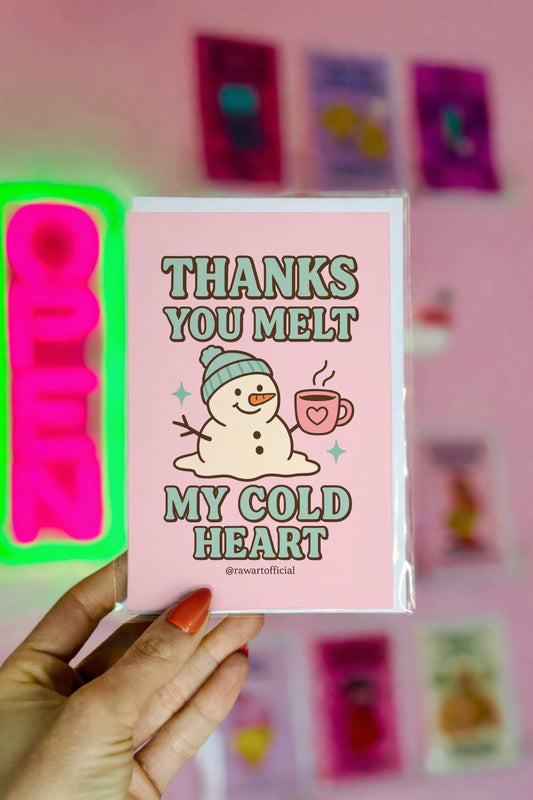 Greeting card featuring a melting snowman holding a mug with the text “Thanks You Melt My Cold Heart.”