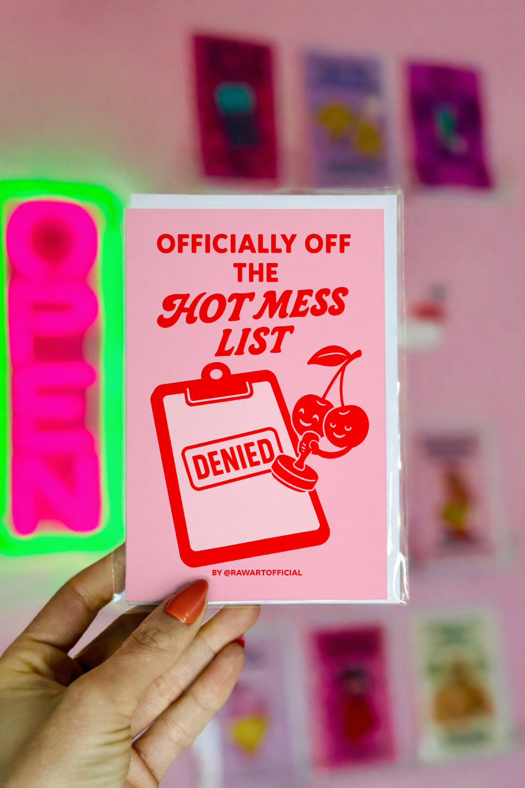 Retro cherry greeting card with clipboard and "Hot Mess List Denied" design in bold red on pink background.