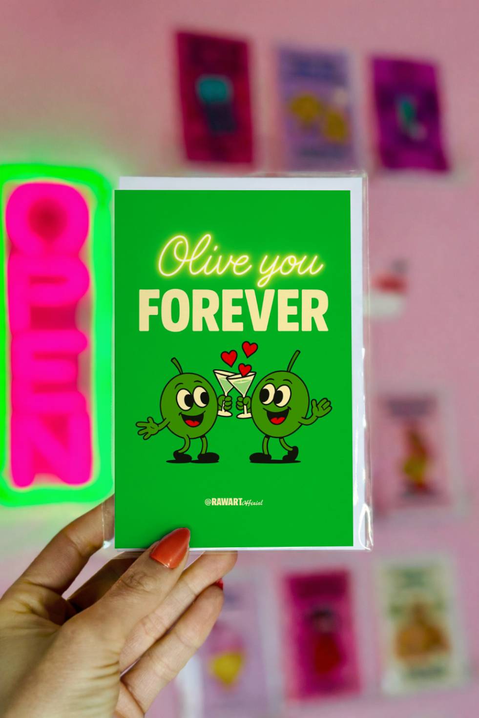 Funny greeting card reading “Olive You Forever” with two cartoon olives clinking martini glasses on a bright green background.
