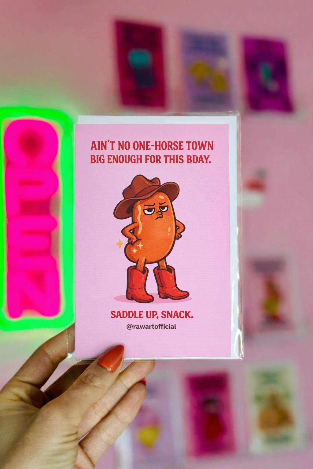 funny birthday card featuring a cowboy bean wearing boots on a pink background western food pun illustration