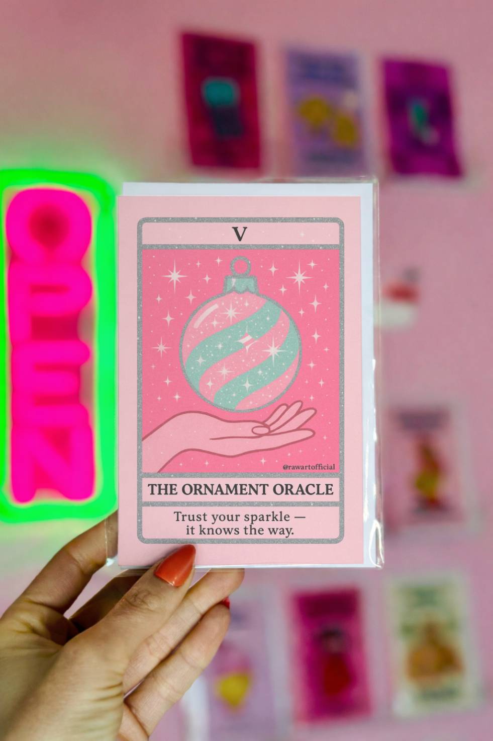 Tarot-style greeting card with a floating Christmas ornament labeled “The Ornament Oracle.”