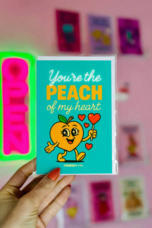 Funny greeting card reading “You’re the Peach of My Heart” with a cartoon peach holding heart balloons on a teal background.