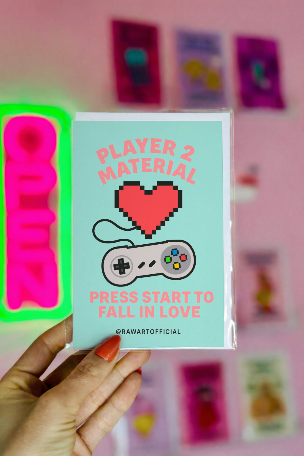 Funny retro Valentine card with a pixelated red heart and game controller reading “Player 2 Material – Press Start to Fall in Love.”